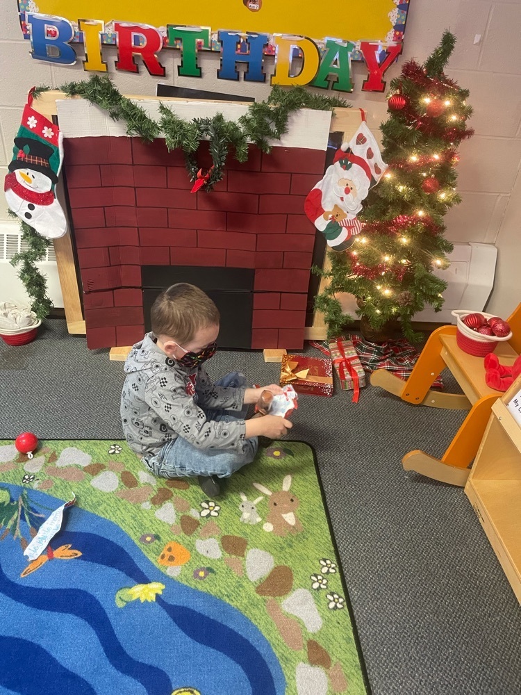 preschooler opening a present 