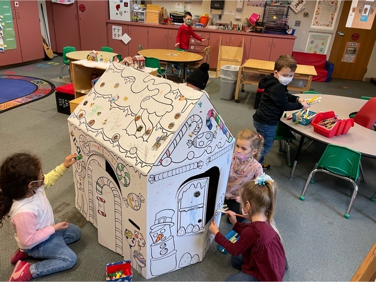 preschoolers colored cardboard house