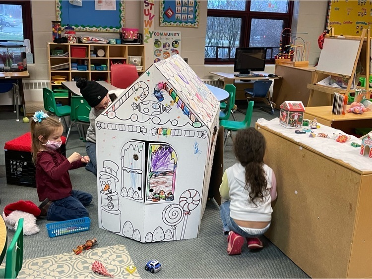 preschoolers colored cardboard house