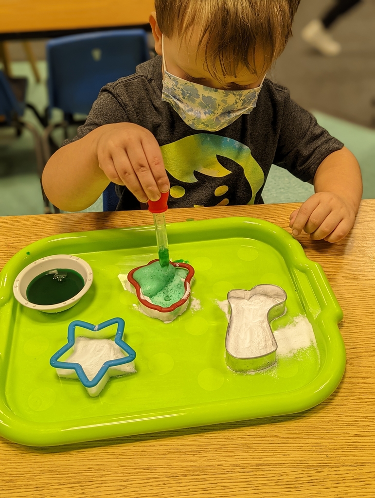 preschool child playing with vinegar and baking soda!