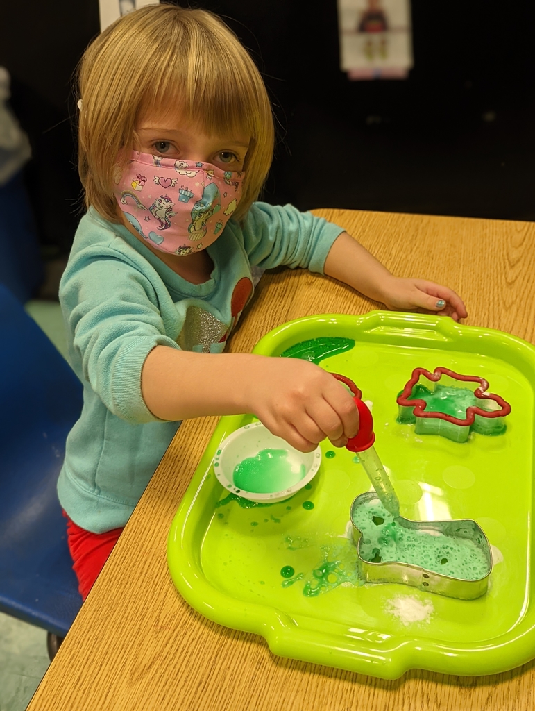 preschool child playing with vinegar and baking soda!