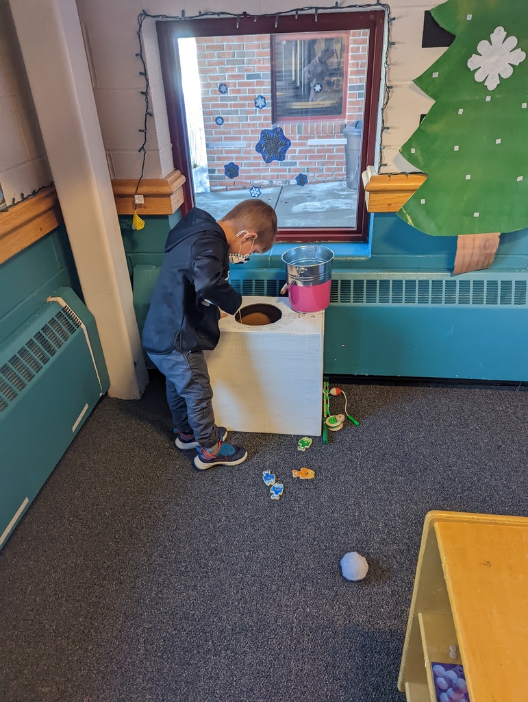 preschooler ice fishing in our Arctic play area